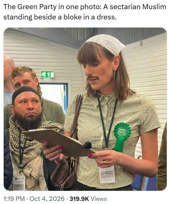 Ïàðòèÿ çåëåíûõ Âåëèêîáðèòàíèè: øîêèðîâàííûé ìóñóëüìàíèí ñìîòðèò íà ìóæèêà â æåíñêîé áëóçêå